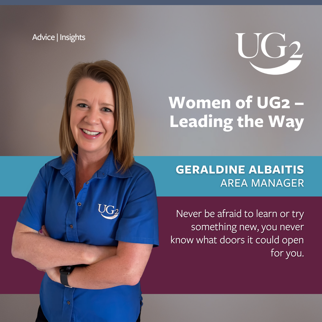 A woman in a blue UG2 shirt stands with her arms crossed, smiling confidently. Text highlights her role as Area Manager, leading the way with an inspirational quote about learning and opportunity.
